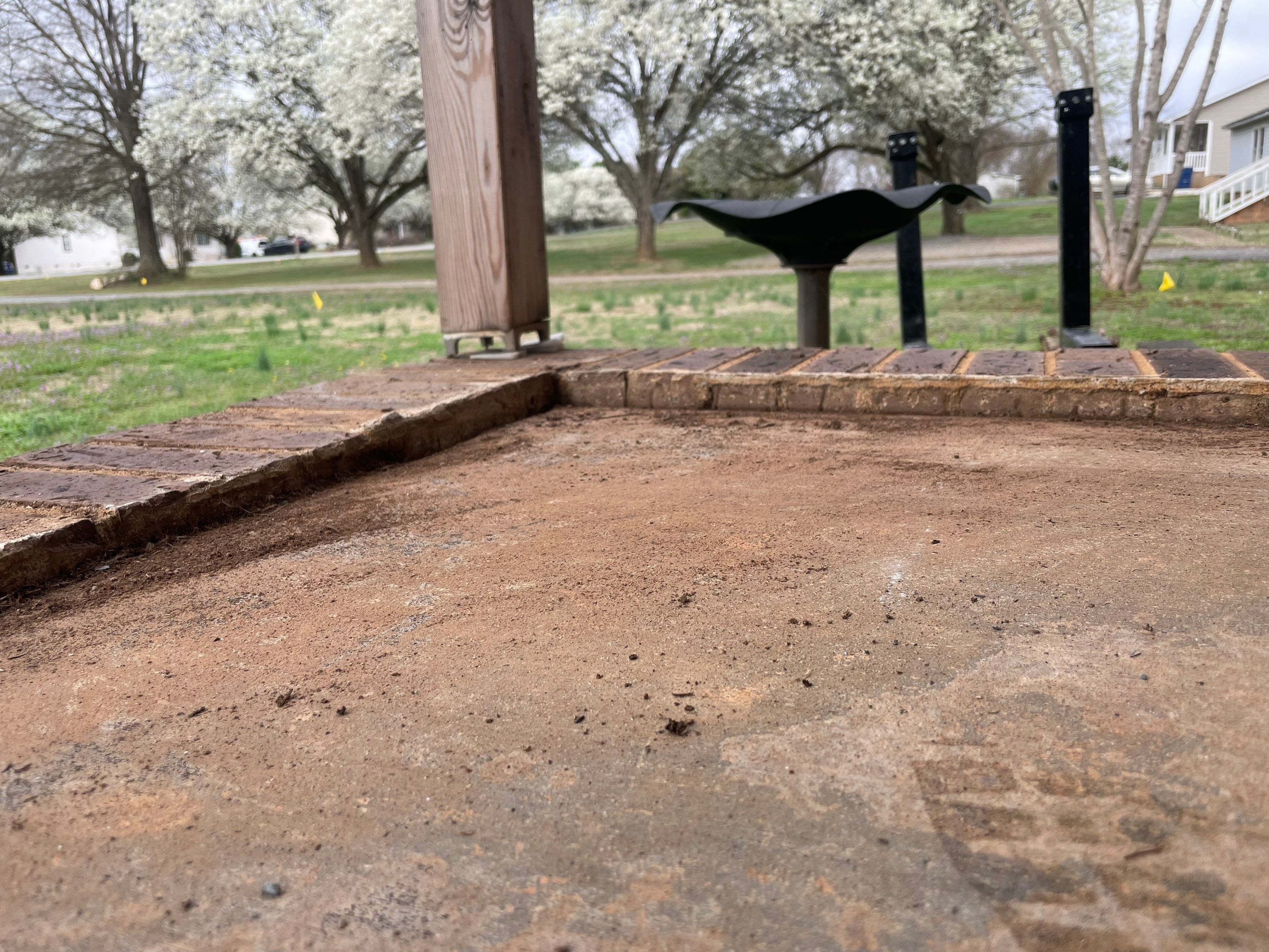 Concrete slab dropped below brick step before leveling