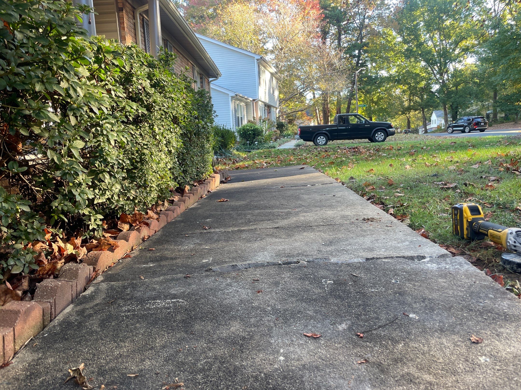 Sunken concrete sidewalk slab dropped below adjacent panels
