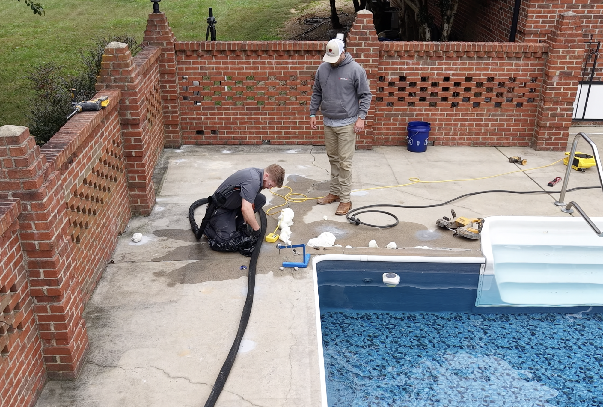 Completed concrete leveling project showing lifted driveway flush with surrounding slab