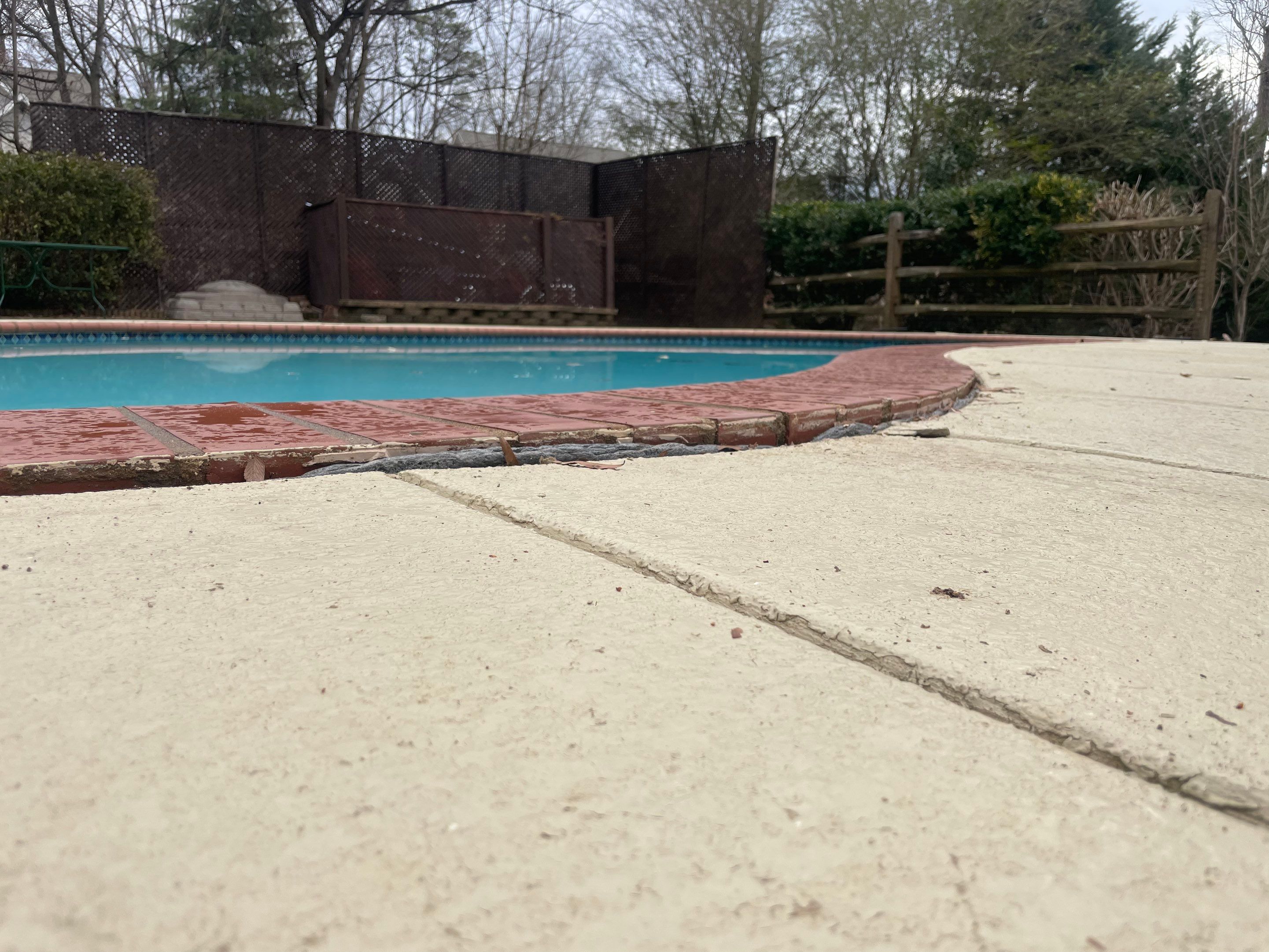 Visible gap between sunken pool deck slab and pool coping