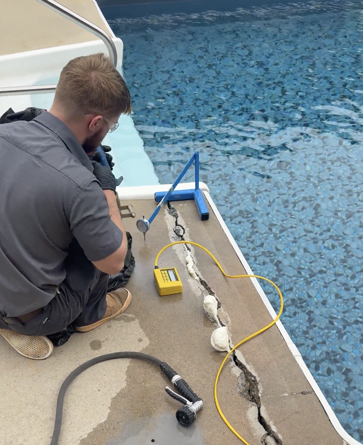 Crew leveling a concrete patio with polyurethane foam injection